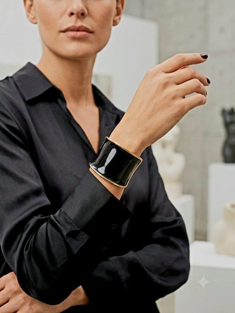 Fancy Bangle (Category: Bracelets) located in Singapore. Submitted by zhmodernmix (Listing ID 1450069276, Image 2). Description: 🔶 Fancy wide, cuff-style bangle 🔶 Striking contrast of brushed rustic gold and glossy black. 🔶 Decorative panel features a smooth, glossy black inlay. 🔶 A visible coiled metal spring sits at the hinge joint on the side..