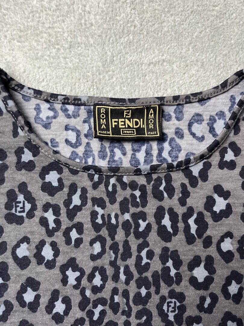 Fendi Jeans Leopard Print Long Sleeve Top (Category: Longsleeves) located in Manila. Submitted by _choso (Listing ID 1450079791, Image 2). Description: - Authentic Fendi Jeans top - Classic leopard print with subtle Fendi logo pattern - Made in Italy - Model number: 12.542963 12005 - Ideal for a stylish casual look.