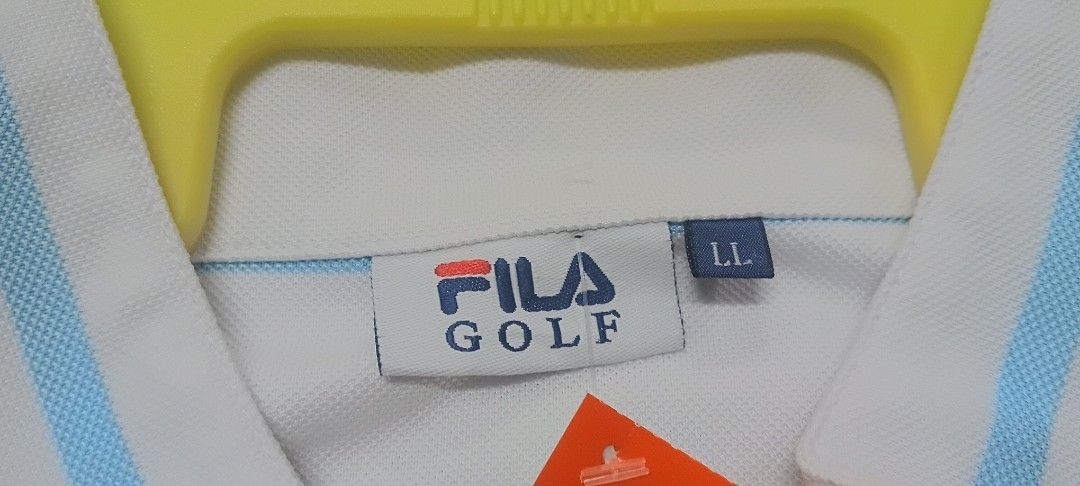 Fila Golf Striped Polo Shirt LL (Category: Tshirts & Polo Shirts) located in Senawang. Submitted by kedailanbundle (Listing ID 1450043979, Image 3). Description: - Fila Golf polo shirt - Color: White with light blue stripes - Neckline: Quarter zip - Size: LL (Large Large) - Features: Crest detail on chest - Ideal for: Golfing or casual wear pit 21 labuh 28 harga termasuk pos semenanjung sahaja.