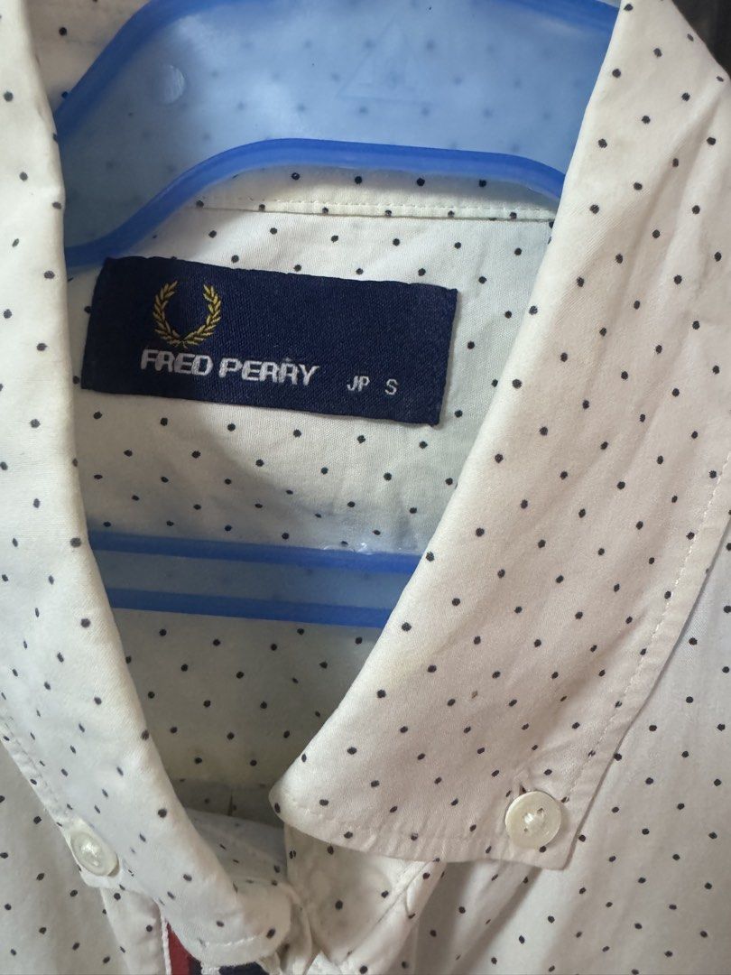 Fred Perry Short Sleeve Polka Dot Shirt JP S (Category: Tshirts & Polo Shirts ) located in Quezon City. Submitted by furious0128 (Listing ID 1450036421, Image 2). Description: - White short sleeve shirt from Fred Perry - Subtle black polka dot pattern all over - Navy and red stripe detail down the front placket - Small embroidered laurel wreath logo on the chest pocket - Button-down collar - Size JP S.
