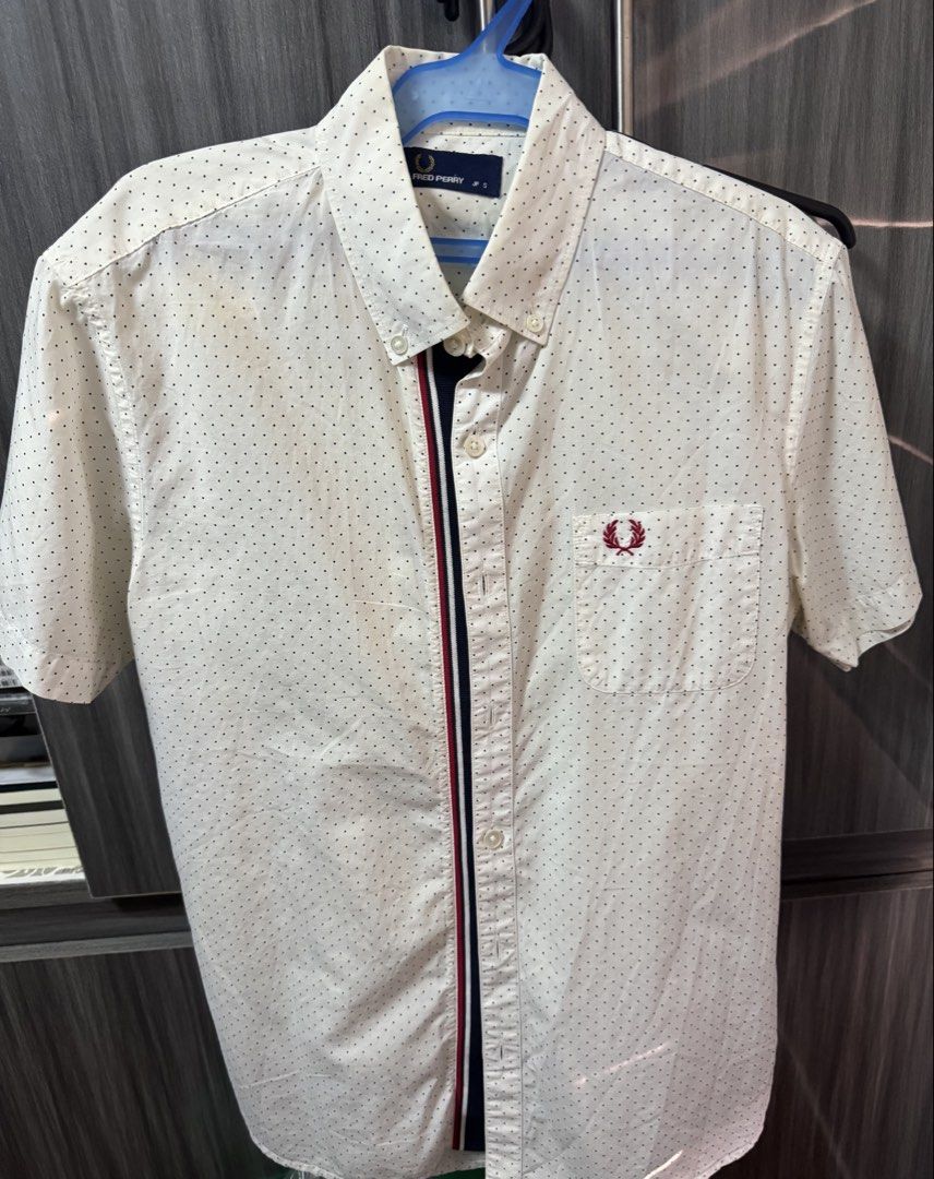Fred Perry Short Sleeve Polka Dot Shirt JP S (Category: Tshirts & Polo Shirts ) located in Quezon City. Submitted by furious0128 (Listing ID 1450036421, Image 1). Description: - White short sleeve shirt from Fred Perry - Subtle black polka dot pattern all over - Navy and red stripe detail down the front placket - Small embroidered laurel wreath logo on the chest pocket - Button-down collar - Size JP S.