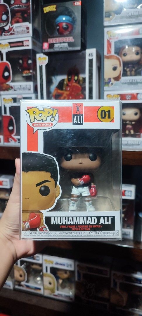 Funko Pop Muhammad Ali #01 Vinyl Figure (Category: Figurines & Statues) located in Manila. Submitted by jefftheplug (Listing ID 1450041821, Image 1). Description: Got the Muhammad Ali Funko Pop #01. It's the vinyl figure. Box is clear and shows the figure well. Great for any boxing fan or collector. Never opened with Boss protector.