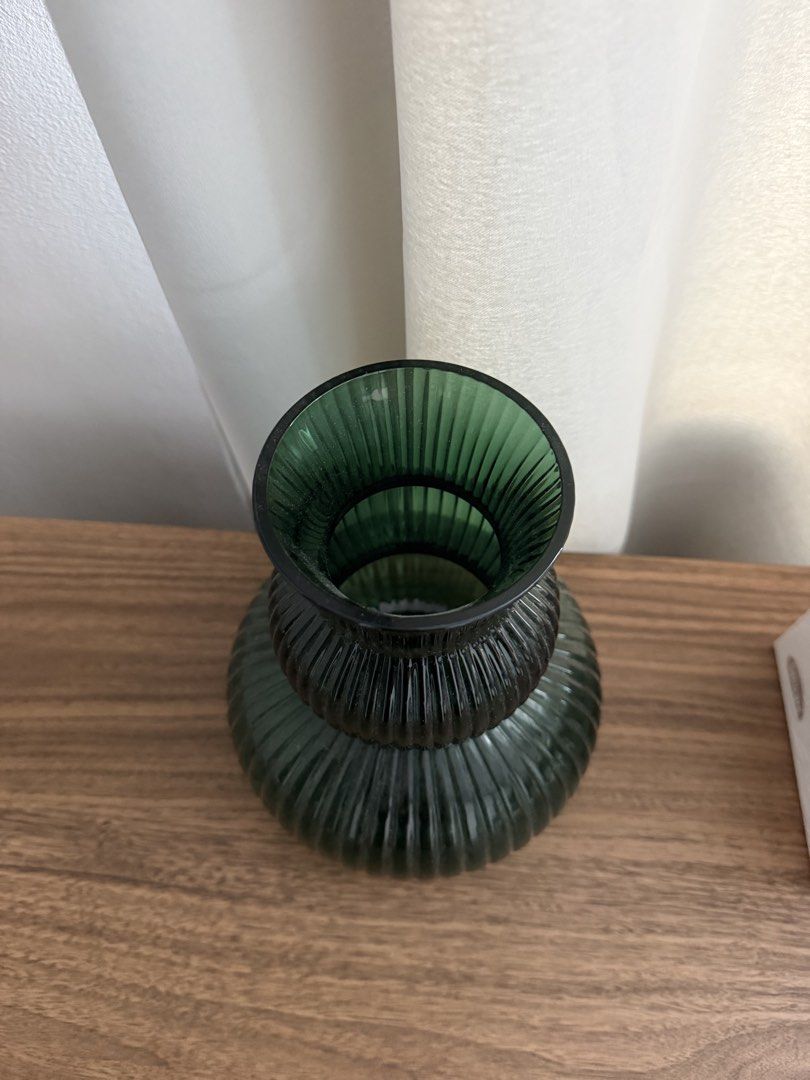 Green Ribbed Glass Vase (Category: Vases & Decorative Bowls) located in Manila. Submitted by bitofthings (Listing ID 1450007113, Image 2). Description: - Elegant dark green glass vase. - Features a beautiful ribbed texture all over. - Unique bulbous shape that tapers towards the top. - Ideal for showcasing your favorite flowers. - Also a stunning standalone decorative piece. - Adds a vibrant pop of color to any space..
