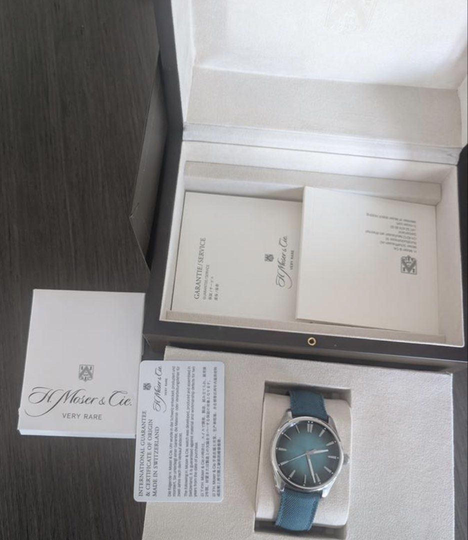 H. Moser & Cie Watch with Box and Papers (Category: Luxury Watches) located in Manila. Submitted by koji18 (Listing ID 1450124728, Image 1). Description: - Brand: H. Moser & Cie Pioneer Mega Cool - Dial Color: Teal - Strap Color: Teal - Condition: Very Rare Piece - Includes: Original Box, Guarantee, Certificate of Origin 2 extra OEM Straps 17k each - Origin: Made in Switzerland Open to trade with Rolex Submariner or batman ( willing to add cash )