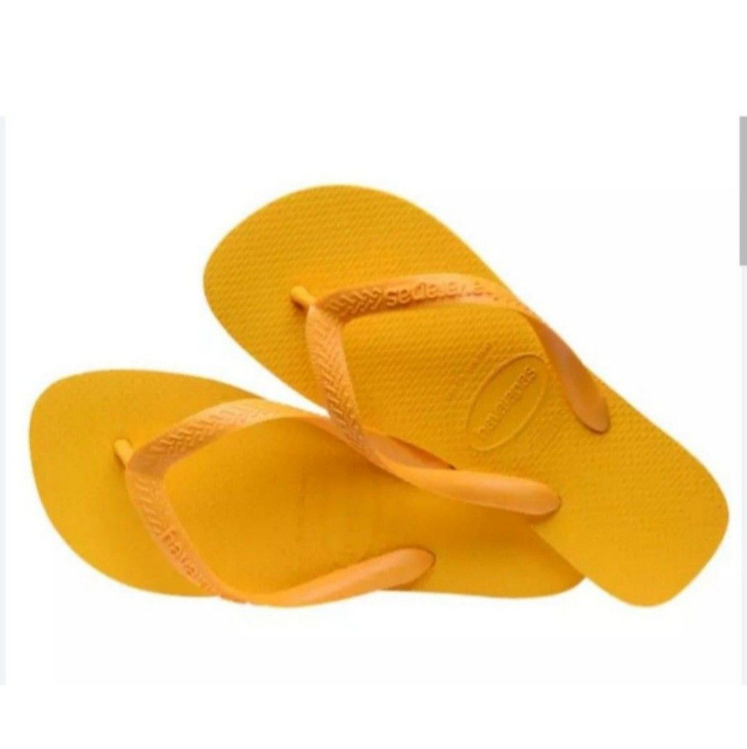 Havaianas Yellow Flip-flops (Category: Slippers and slides) located in Bocaue. Submitted by michellesell_2 (Listing ID 1450120622, Image 2). Description: - Classic Havaianas flip-flops - Vibrant yellow color - Textured sole for enhanced grip - Comfortable and easy to wear - Ideal for beach trips and casual outings - A summer essential.