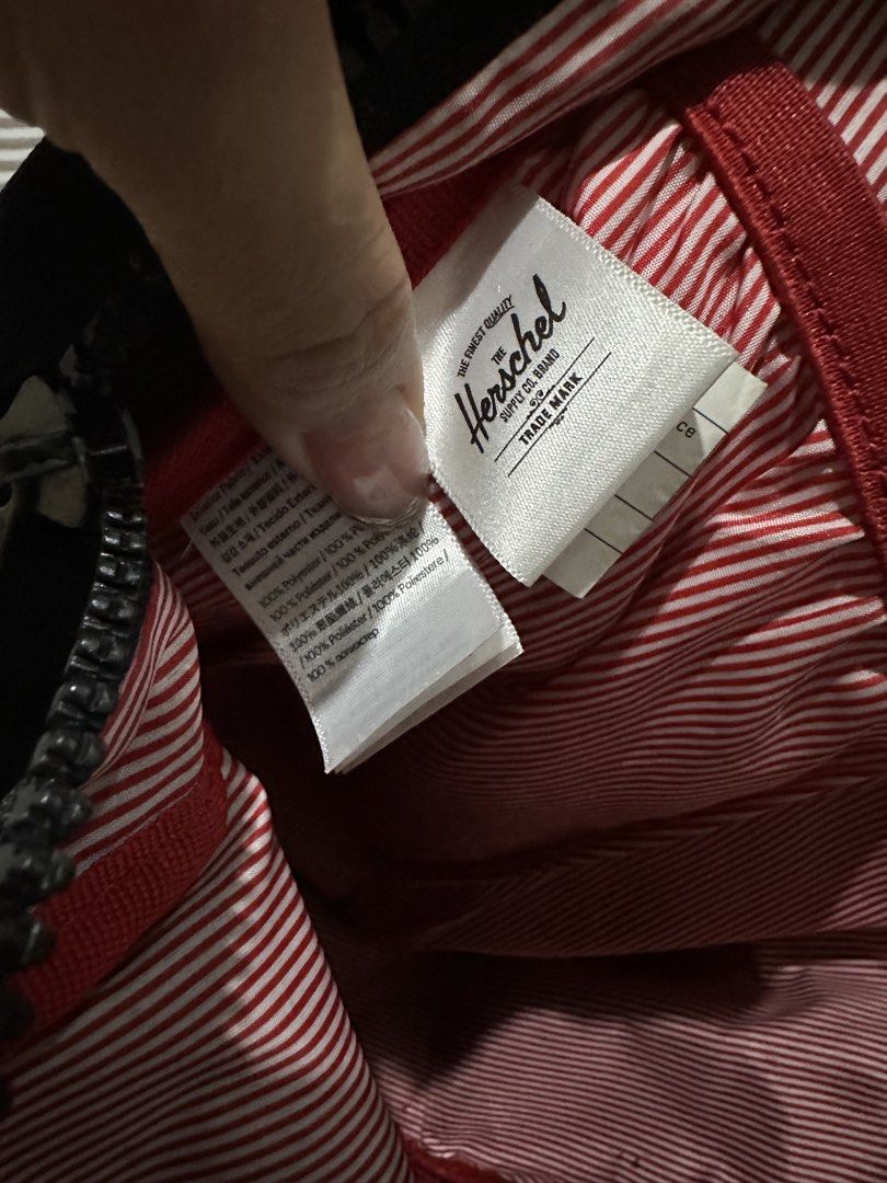 Herschel Supply Co. Backpack - Black Red Checkerboard (Category: Backpacks) located in Bulacan. Submitted by deicalayag (Listing ID 1450046130, Image 2). Description: - Classic black Herschel backpack - Red accent details - Unique checkerboard front pocket - Signature red and white striped interior - Spacious main compartment - Convenient front zip pocket - Ideal for everyday carry and school essentials.