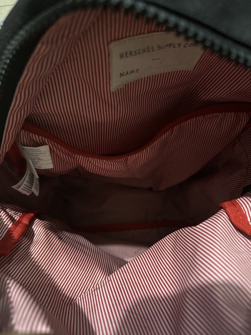 Herschel Supply Co. Backpack - Black Red Checkerboard (Category: Backpacks) located in Bulacan. Submitted by deicalayag (Listing ID 1450046130, Image 3). Description: - Classic black Herschel backpack - Red accent details - Unique checkerboard front pocket - Signature red and white striped interior - Spacious main compartment - Convenient front zip pocket - Ideal for everyday carry and school essentials.