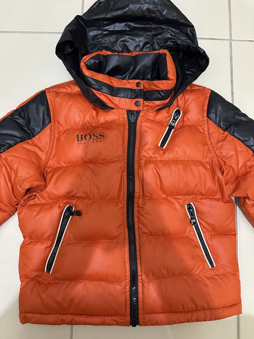 HUGO BOSS reversible puffer black orange packable hood (Category: Babies & Kids Fashion) located in Cavite. Submitted by jdfselectify (Listing ID 1450070982, Image 3). Description: Very good condition 6 on tag can fit 5-8yo Unisex Reversible Packable hood.