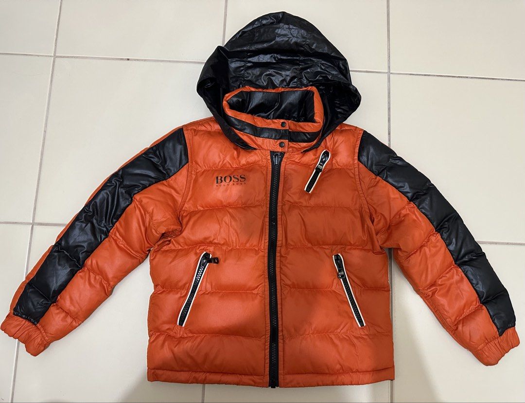 HUGO BOSS reversible puffer black orange packable hood (Category: Babies & Kids Fashion) located in Cavite. Submitted by jdfselectify (Listing ID 1450070982, Image 1). Description: Very good condition 6 on tag can fit 5-8yo Unisex Reversible Packable hood.