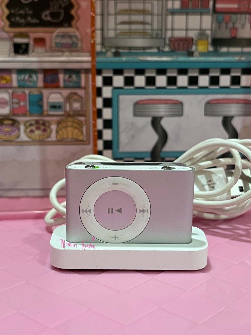 iPod Shuffle 2nd Gen with Dock cradel (Category: Portable Music Players) located in Valenzuela. Submitted by moshiiri_kawaii_v2 (Listing ID 1450108126, Image 1). Description: iPod Shuffle 2nd Gen - 1gb Working Goods pa battery Can sync sa itunes or finder With original usb dock cradle for charging and transfer music Flaws: sign of use, scratches and dents check pic.