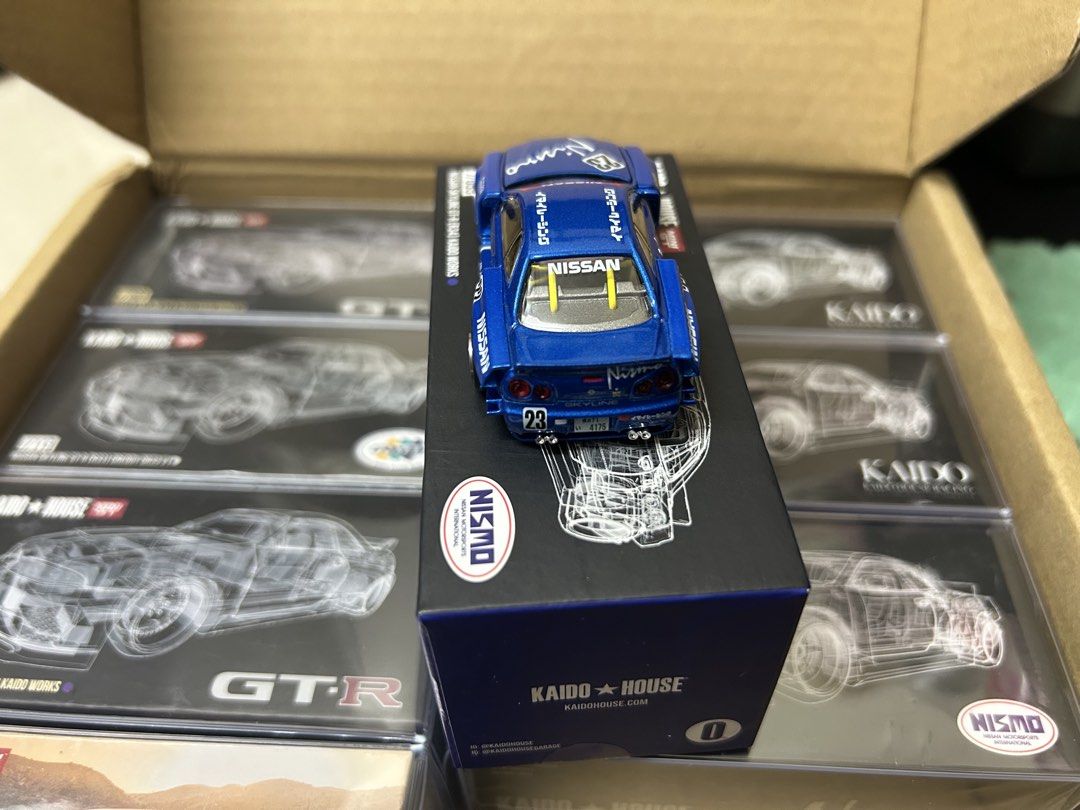 KAIDO HOUSE R34 white & blue (lot) (Category: Toys & Games) located in Kuala Lumpur. Submitted by Dannyz (Listing ID 1450069302, Image 1). Description: - KAIDO HOUSE x MINI GT Nissan Skyline GT-R (R34) NISMO - Model Number: 055 - Striking blue color with authentic NISMO livery - Features an opening hood for detailed viewing - Comes in its original, pristine box - A must-have addition for any diecast car collector UNSEAL .