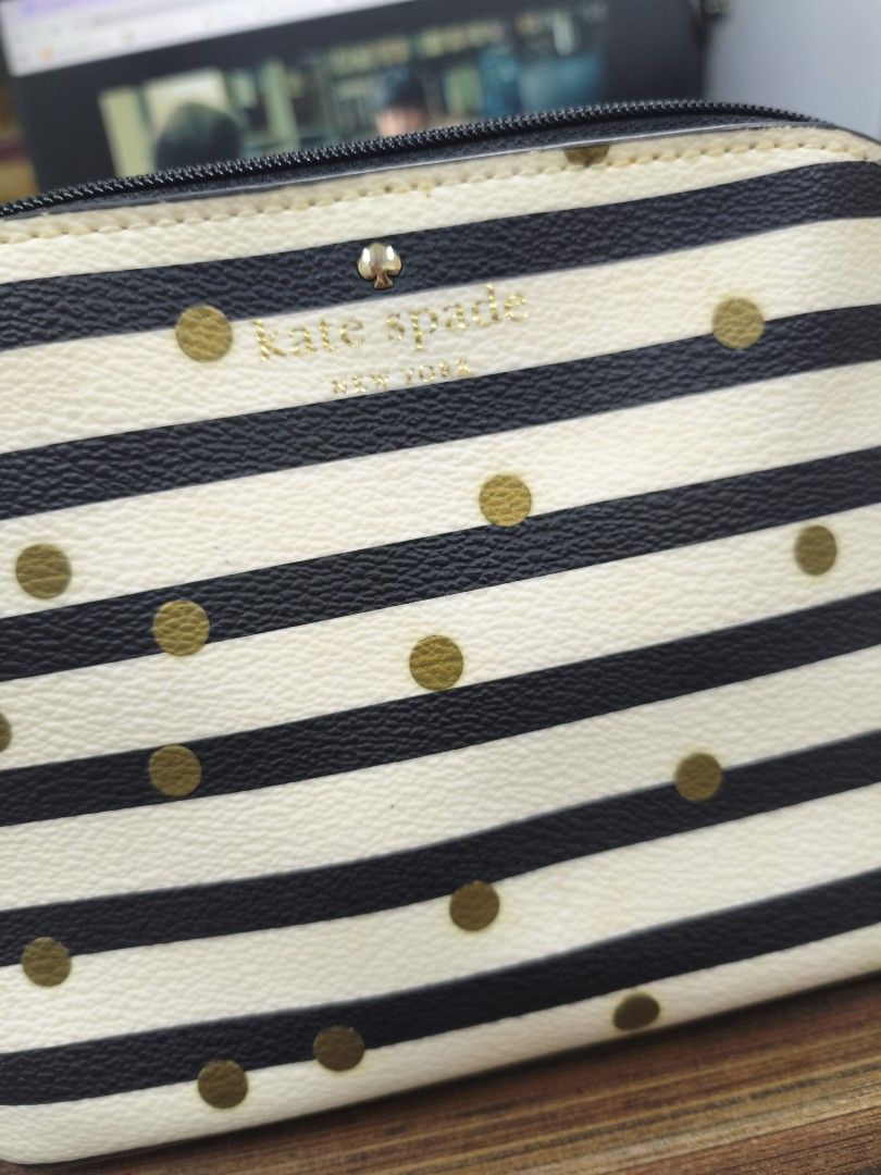 Kate Spade Striped Polka Dot Cosmetic Bag (Category: Luxury Bags & Wallets) located in Antipolo. Submitted by prelovedbyfhaye (Listing ID 1449977948, Image 2). Description: - Authentic Kate Spade cosmetic bag / pouch - Chic black and white stripe design with gold polka dots - Secure zipper closure with a stylish leather pull tab - Ideal for storing makeup, toiletries, or travel essentials - Compact size fits easily into your daily handbag.