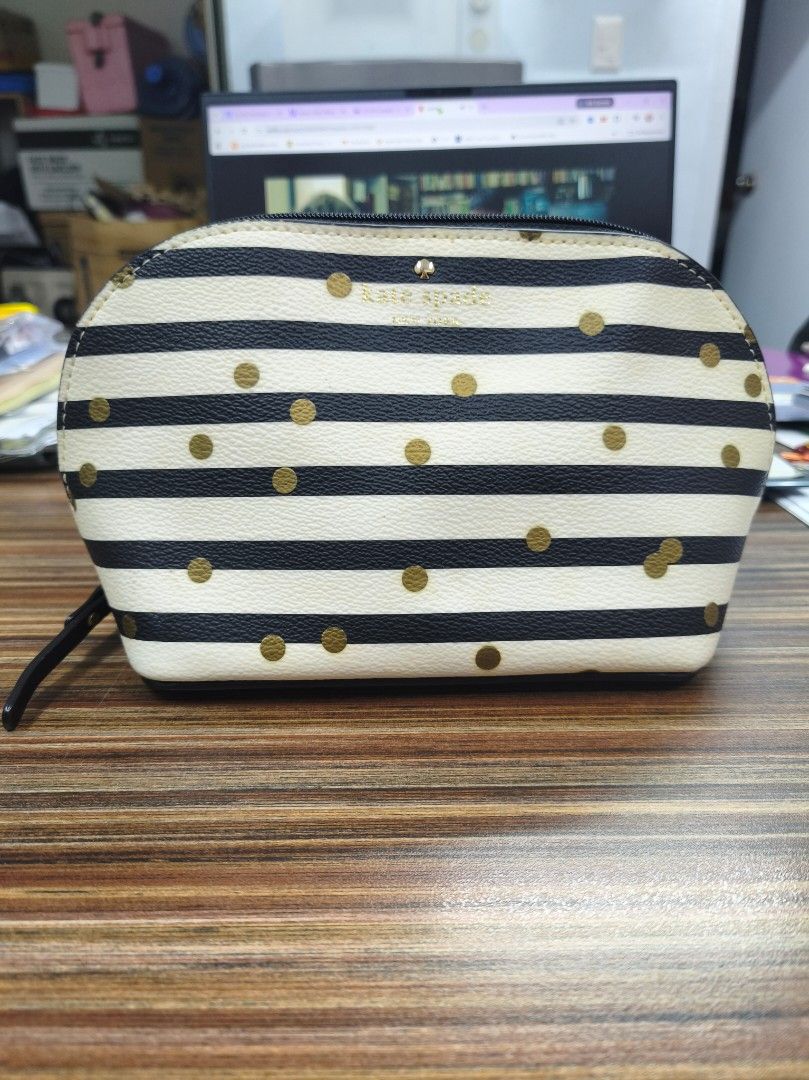 Kate Spade Striped Polka Dot Cosmetic Bag (Category: Luxury Bags & Wallets) located in Antipolo. Submitted by prelovedbyfhaye (Listing ID 1449977948, Image 1). Description: - Authentic Kate Spade cosmetic bag / pouch - Chic black and white stripe design with gold polka dots - Secure zipper closure with a stylish leather pull tab - Ideal for storing makeup, toiletries, or travel essentials - Compact size fits easily into your daily handbag.