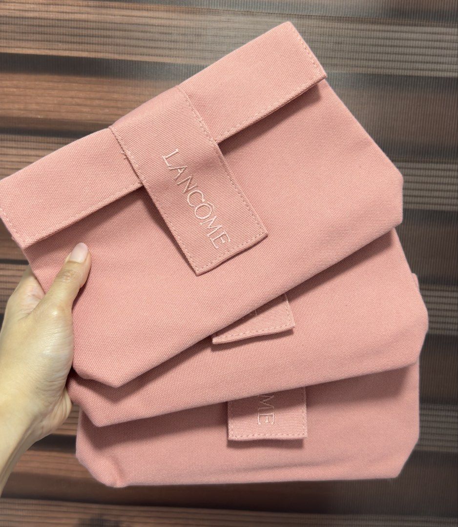 Lancome Pink Canvas Pouch / Make-up Bag (Category: Purses & Pouches) located in Mandaluyong City. Submitted by shoppingmilesph (Listing ID 1450025034, Image 2). Description: ❣️Brand: Original Lancome ❣️Color: Pink Peach ❣️Flap closure ❣️Material: Canvas ❣️Design: Embroidered Lancome brand name .