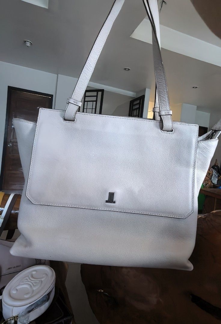 Lanvin Tote Bag (Category: Luxury Bags & Wallets) located in Cagayan de Oro. Submitted by tommygurl1218 (Listing ID 1450023802, Image 1). Description: - Lanvin tote bag - Color: off white /light gray - Material: Leather - Closure: Flap with metal logo detail, interior zipper - Straps: Adjustable - Size: Ideal for everyday use - Condition: Please check photos for details With minimal. Sign of use .