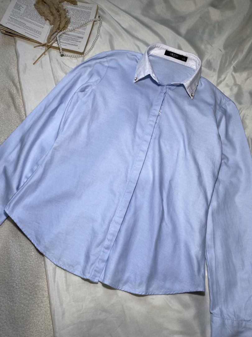 Light Blue Button-Up Shirt with White Collar Small Bust 34 (Category: Tshirts & Polo Shirts ) located in Poro. Submitted by joyceyuu (Listing ID 1450049096, Image 2). Description: - Classic light blue button-up shirt - Crisp white collar with subtle gold accents - Long sleeves with button cuffs - Sharp and clean look - Versatile for work or casual wear - Easy to pair with any outfit.