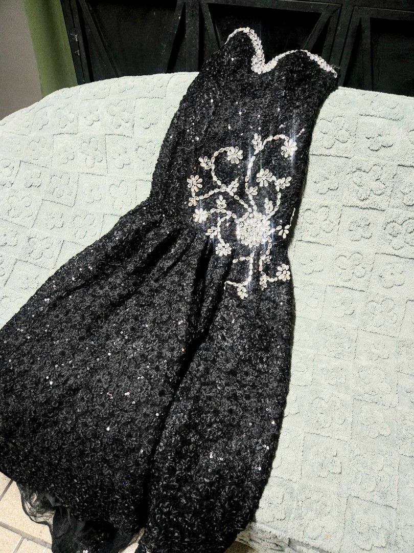 Long trail black gown (Category: Dresses) located in Manila. Submitted by oki.ukay (Listing ID 1450069124, Image 1). Description: Bust size up to 30in Waist up to 32 in Long trail design: front 43in, back 57in Location: manila.