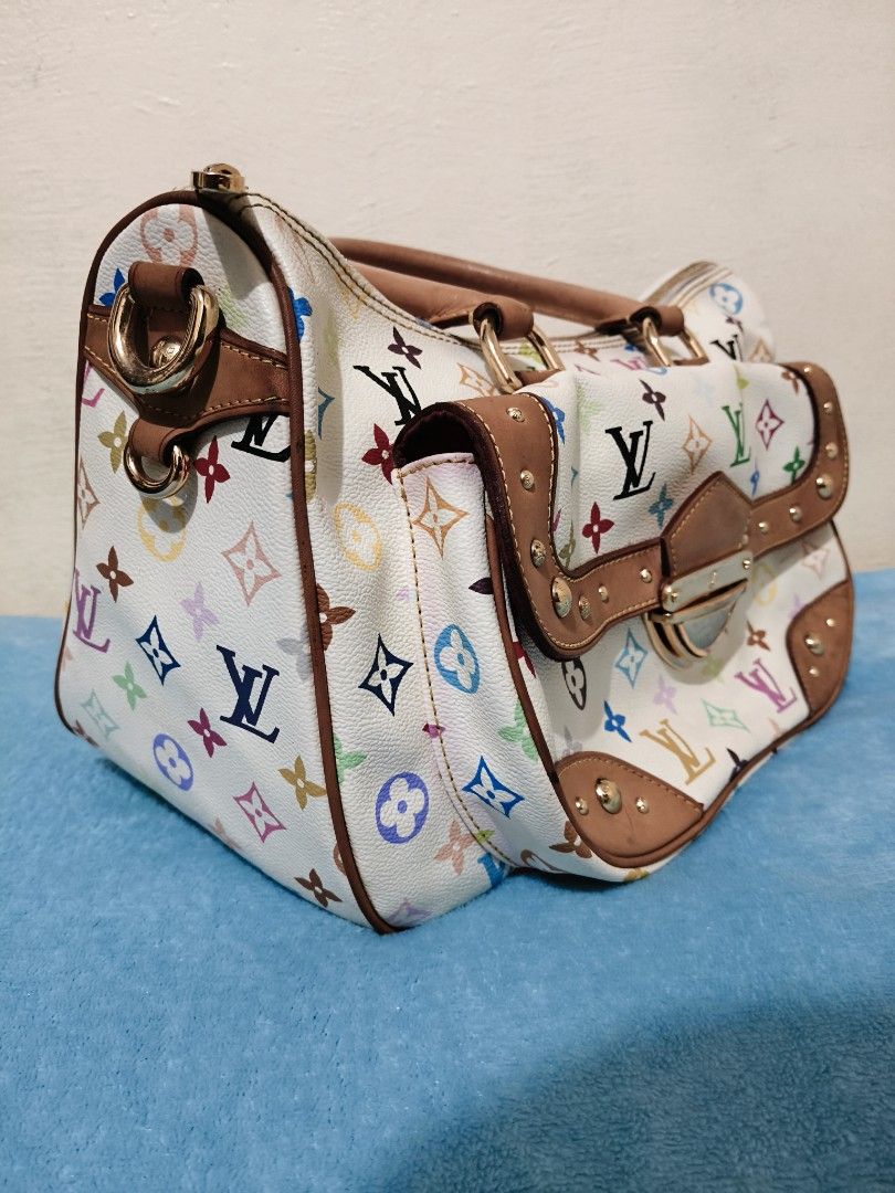 Louis Vuitton (Category: Luxury Bags & Wallets) located in Mandaue City. Submitted by prekfinds (Listing ID 1450065973, Image 3). Description: Louis Vuitton Rita X Takashi Murakami Handbag Monogram Multicolor Gold-color Excellentcondition Width34cm,Hieght23cm,18cm Depth Very clean interior Very presentable Minimal dirt and scratch No major flaws.