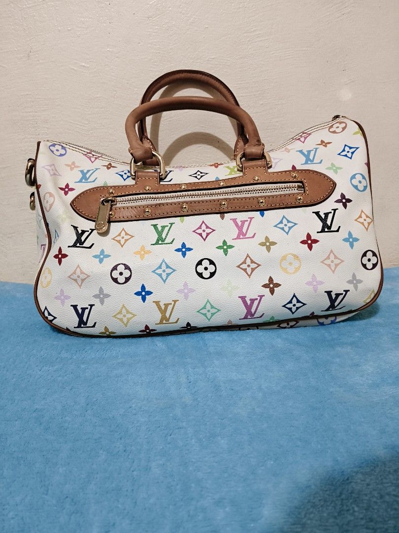 Louis Vuitton (Category: Luxury Bags & Wallets) located in Mandaue City. Submitted by prekfinds (Listing ID 1450065973, Image 2). Description: Louis Vuitton Rita X Takashi Murakami Handbag Monogram Multicolor Gold-color Excellentcondition Width34cm,Hieght23cm,18cm Depth Very clean interior Very presentable Minimal dirt and scratch No major flaws.