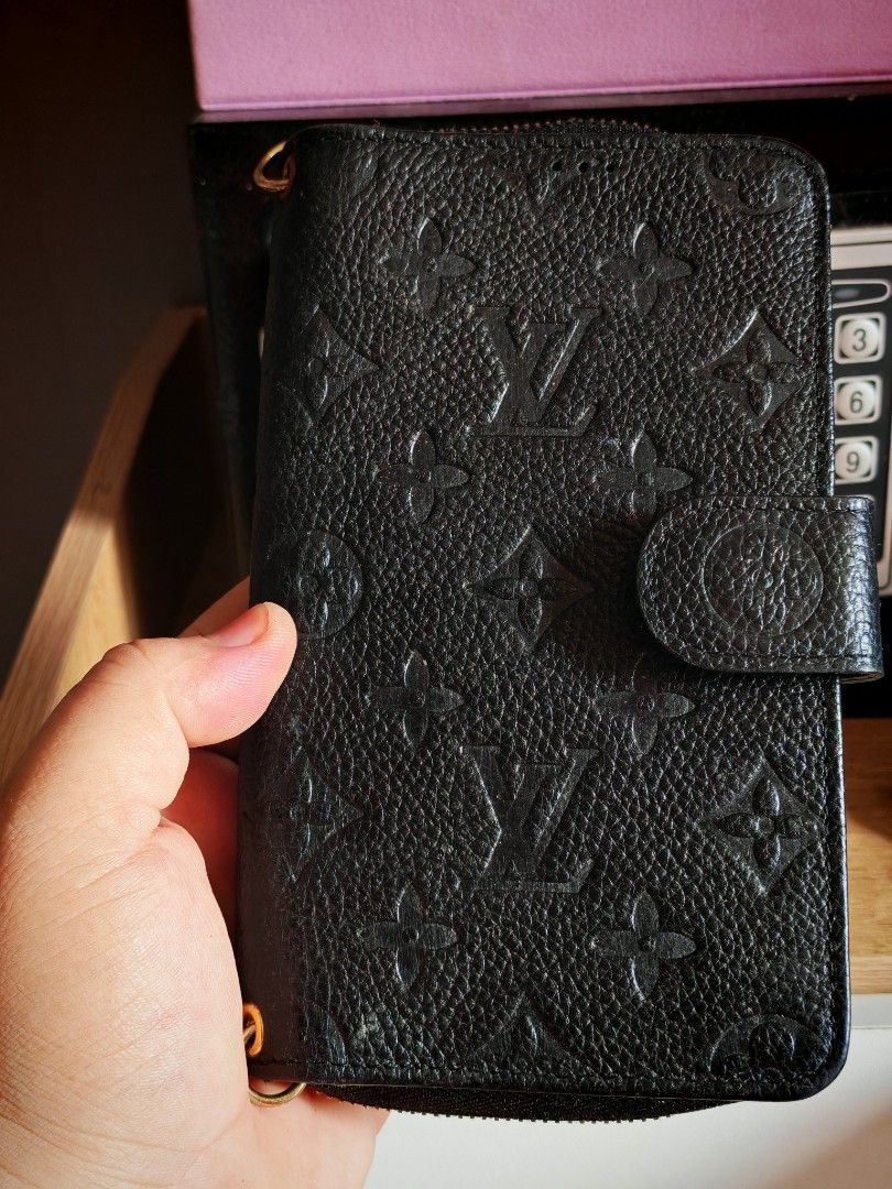 Louis Vuitton Monogram Empreinte Zipped Wallet (Category: Luxury Bags & Wallets) located in Manila. Submitted by cleverwhale_45b7bc (Listing ID 1449962379, Image 1). Description: - Louis Vuitton Wallet - Color: Black - Material: Monogram Empreinte Leather - Closure: Zip-around - Interior: Multiple card slots, zipped compartment - Hardware: Gold-tone - Dimensions (approx.): 7.5 x 4.5 inches (when closed) - Functionality: Ideal for organizing cards