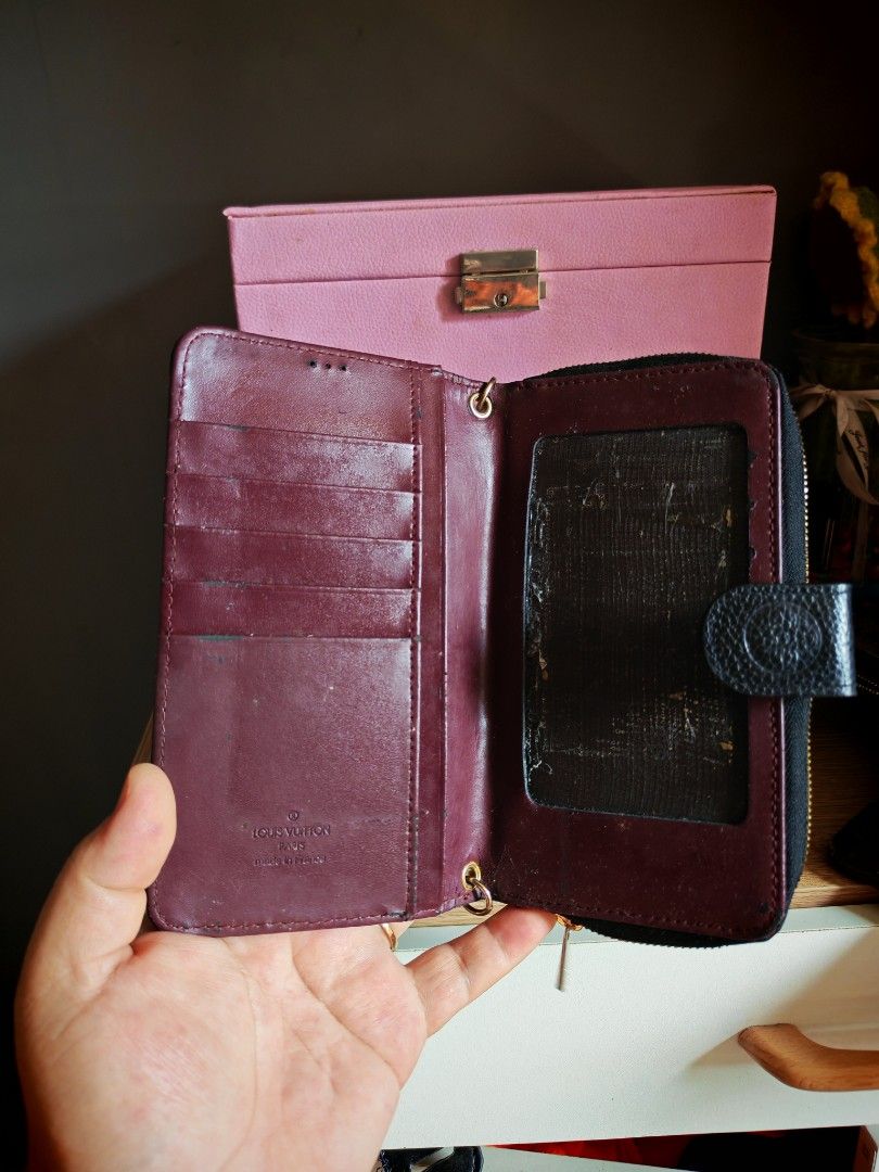Louis Vuitton Monogram Empreinte Zipped Wallet (Category: Luxury Bags & Wallets) located in Manila. Submitted by cleverwhale_45b7bc (Listing ID 1449962379, Image 3). Description: - Louis Vuitton Wallet - Color: Black - Material: Monogram Empreinte Leather - Closure: Zip-around - Interior: Multiple card slots, zipped compartment - Hardware: Gold-tone - Dimensions (approx.): 7.5 x 4.5 inches (when closed) - Functionality: Ideal for organizing cards
