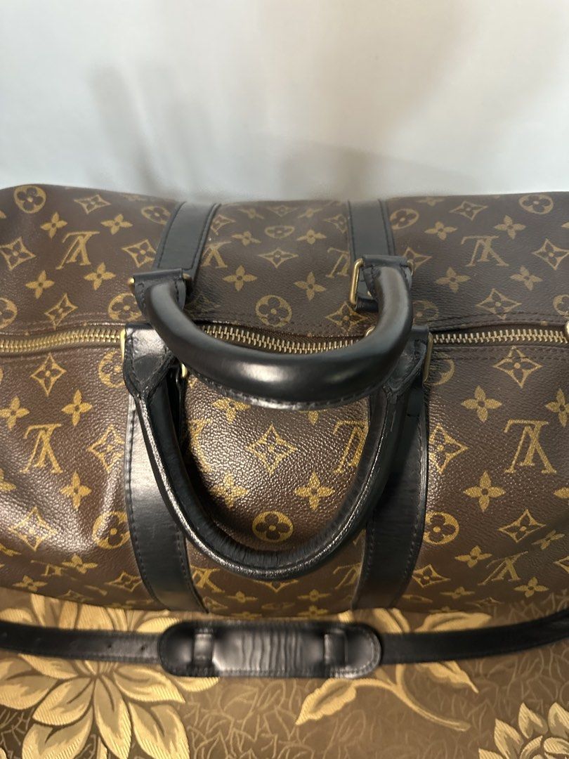 Louis Vuitton Monogram Keepall Duffle Bag (Category: Luxury Bags & Wallets) located in Batangas. Submitted by jim2621 (Listing ID 1449974289, Image 3). Description: - Classic Louis Vuitton Keepall duffle bag - Monogram canvas with black leather trim and handles - Detachable shoulder strap included - Ideal for travel or weekend getaways - Zippers are smooth and functional - Minor signs of wear on leather and hardware, consistent with age and use -