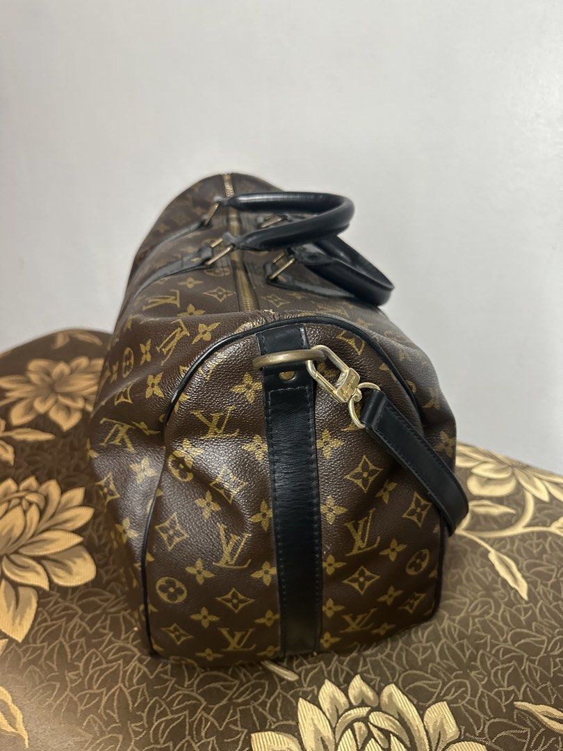 Louis Vuitton Monogram Keepall Duffle Bag (Category: Luxury Bags & Wallets) located in Batangas. Submitted by jim2621 (Listing ID 1449974289, Image 2). Description: - Classic Louis Vuitton Keepall duffle bag - Monogram canvas with black leather trim and handles - Detachable shoulder strap included - Ideal for travel or weekend getaways - Zippers are smooth and functional - Minor signs of wear on leather and hardware, consistent with age and use -