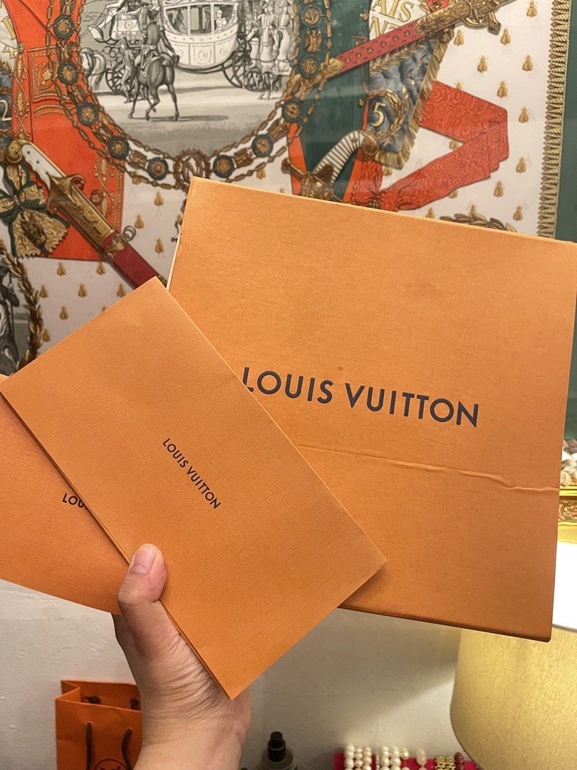 Louis Vuitton Orange Box and Envelopes (Category: Luxury Bags & Wallets) located in Marilao. Submitted by wardrovearchives (Listing ID 1450062217, Image 1). Description: - Authentic Louis Vuitton orange box - Two Louis Vuitton orange envelopes - Ideal for gifting or storing small valuables - Features iconic Louis Vuitton logo and branding - Elevates any present with a touch of luxury.