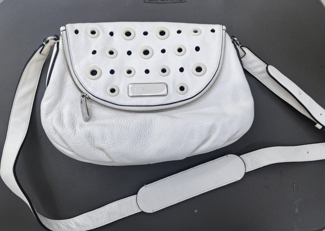 Marc by Marc Jacobs White Leather Studded Shoulder Bag (Category: Luxury Bags & Wallets) located in Quezon City. Submitted by flat.earther23 (Listing ID 1450007628, Image 1). Description: - Authentic Marc by Marc Jacobs white leather shoulder bag - Features a cool studded detail on the front flap - Secure zipper closure - Adjustable strap for comfortable wear - Interior zippered pocket for essentials - Ideal for everyday use.