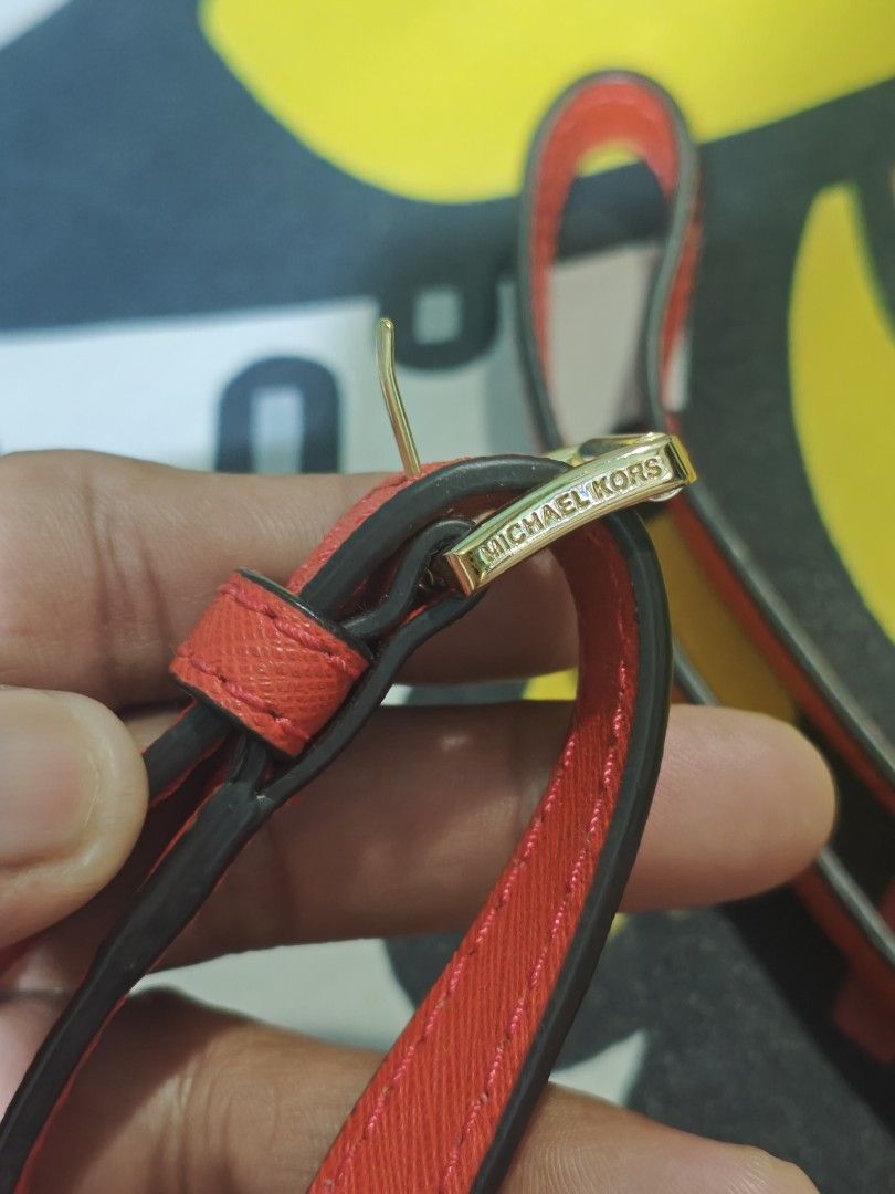Michael Kors Red Leather Bag Strap with Gold Hardware (Category: Luxury Bags & Wallets) located in San Pedro. Submitted by streetthriftsph (Listing ID 1450104408, Image 3). Description: - Genuine red leather strap - Designed for Michael Kors bags - Elegant gold hardware details - Adjustable length with buckle closure - Easily detachable with clips - Ideal for replacing a worn strap or personalizing your bag.