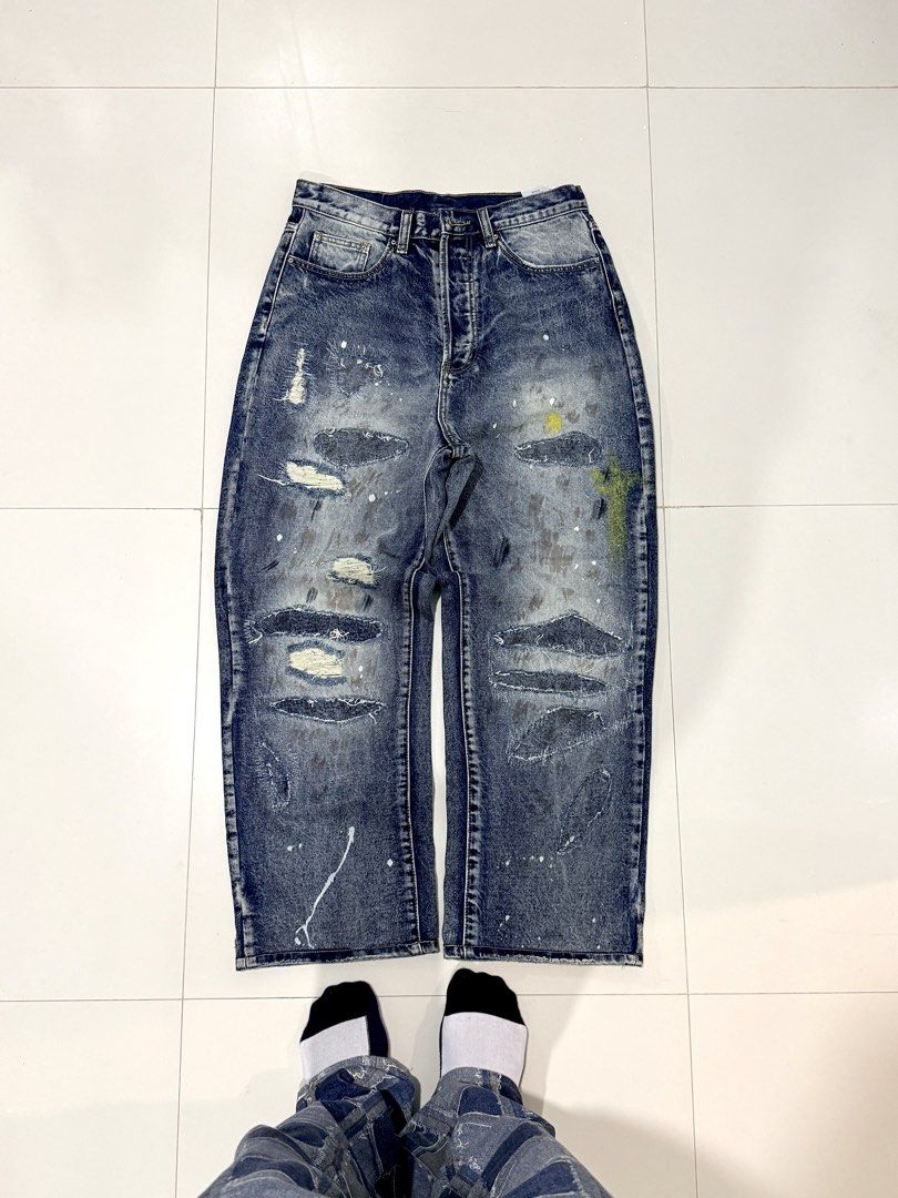 MNML Ultra Baggy Distressed Jeans (Category: Jeans) located in San Juan, La Union. Submitted by bornunderground.ph (Listing ID 1450091985, Image 2). Description: MNML Ultra Baggy Distressed Jeans Authentic/ Like New Sale @ ₱2,495 Plus Shipping - It delivers a heavily customized, vintage streetwear aesthetic. Size: 30 (Model Height 5”7) Silhouette: Cut in an ultra-baggy, wide-leg straight fit that pools casually over sneakers. Heavy Destruction: F