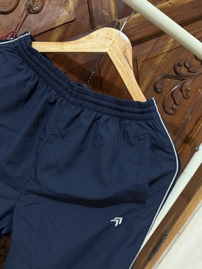 Navy Blue Track Pants with White Stripes (Category: Other Bottoms) located in Iloilo. Submitted by wornwellco (Listing ID 1449999971, Image 2). Description: - Navy blue track pants - White stripe detail down the sides - Comfortable elastic waistband - Size L (170/80A) - Ideal for casual wear or sports - Versatile and easy to pair with any top.