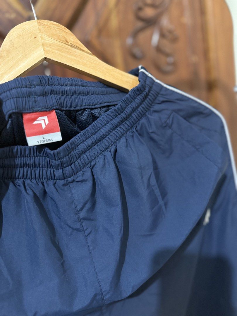Navy Blue Track Pants with White Stripes (Category: Other Bottoms) located in Iloilo. Submitted by wornwellco (Listing ID 1449999971, Image 3). Description: - Navy blue track pants - White stripe detail down the sides - Comfortable elastic waistband - Size L (170/80A) - Ideal for casual wear or sports - Versatile and easy to pair with any top.
