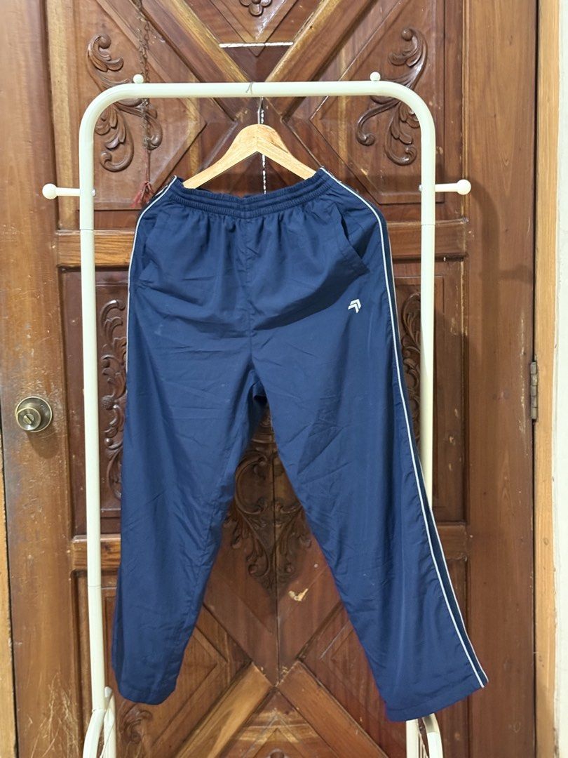Navy Blue Track Pants with White Stripes (Category: Other Bottoms) located in Iloilo. Submitted by wornwellco (Listing ID 1449999971, Image 1). Description: - Navy blue track pants - White stripe detail down the sides - Comfortable elastic waistband - Size L (170/80A) - Ideal for casual wear or sports - Versatile and easy to pair with any top.