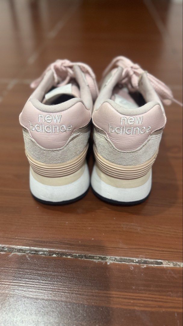 New Balance 574 Pink Platform Sneakers (Category: Sneakers) located in Paombong. Submitted by declutteredbychee_ (Listing ID 1450115159, Image 3). Description: - Pink New Balance 574 platform sneakers - US Size 8 - Light pink and beige colorway - Soles show some dirt from wear - Perfect for casual outfits - No box - Needs cleaning .