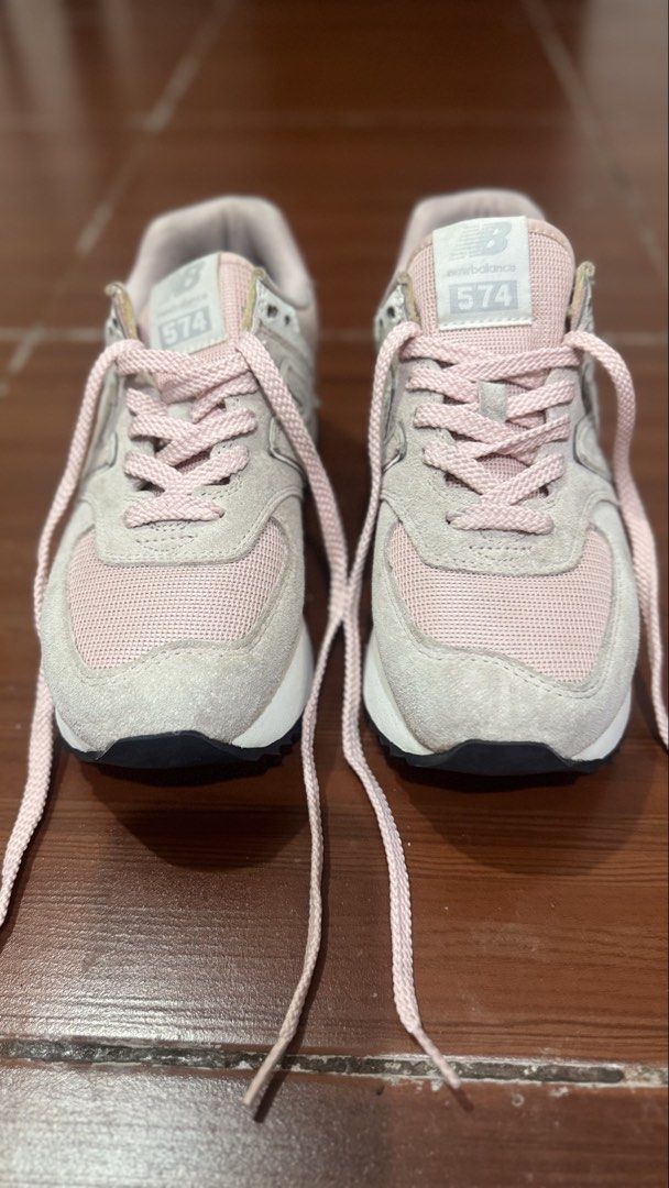 New Balance 574 Pink Platform Sneakers (Category: Sneakers) located in Paombong. Submitted by declutteredbychee_ (Listing ID 1450115159, Image 2). Description: - Pink New Balance 574 platform sneakers - US Size 8 - Light pink and beige colorway - Soles show some dirt from wear - Perfect for casual outfits - No box - Needs cleaning .