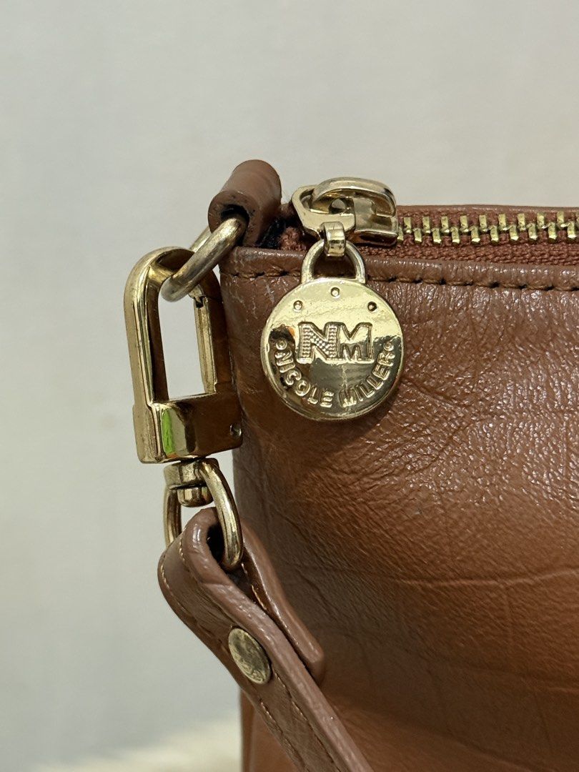 Nicole Miller Shoulder Bag (Category: Shoulder Bags) located in Cainta. Submitted by angellyy_ (Listing ID 1450045897, Image 3). Description: Nicole Miller Small Shoulder Bag With minimal signs of wear ( see pics) Interior is flawless Inside - 2 open pocket & 1 zipped pocket Exterior- 1 back pocket Overall condition - 8.5/10.