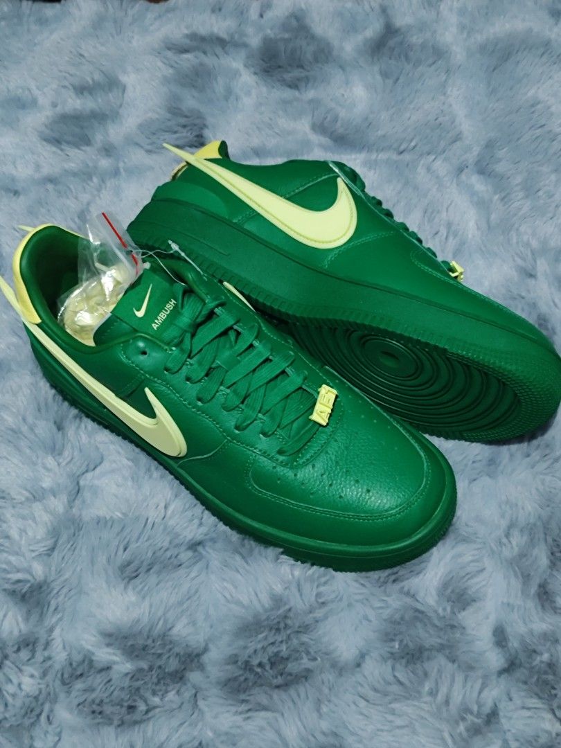 Nike Air Force 1 Low AMBUSH Green (Category: Sneakers) located in Manila. Submitted by crazylocc887246 (Listing ID 1450116795, Image 2). Description: - Authentic Green AMBUSH x Nike Air Force 1 Low sneakers - Distinctive light yellow swoosh and heel tab - Comes with extra laces for customization - Unique and eye-catching design - Highly sought after by collectors.