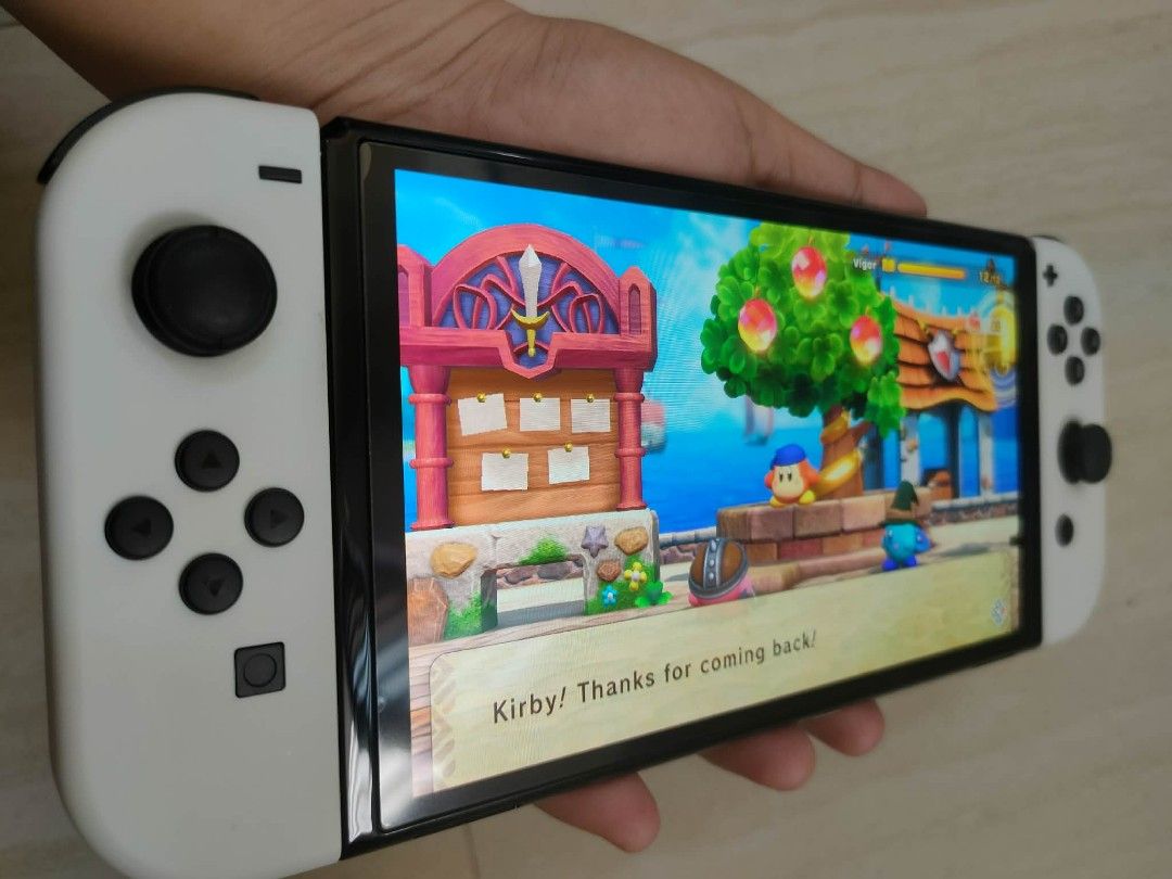 Nintendo switch Oled (Category: Nintendo) located in Manila. Submitted by zealshark.22 (Listing ID 1450073925, Image 3). Description: For sale Nintendo switch Oled complete papo Ang accessories no issue, unli check po need lang Ng Pera di po msyado nagagamit..