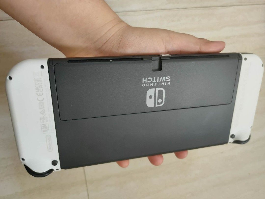 Nintendo switch Oled (Category: Nintendo) located in Manila. Submitted by zealshark.22 (Listing ID 1450073925, Image 2). Description: For sale Nintendo switch Oled complete papo Ang accessories no issue, unli check po need lang Ng Pera di po msyado nagagamit..