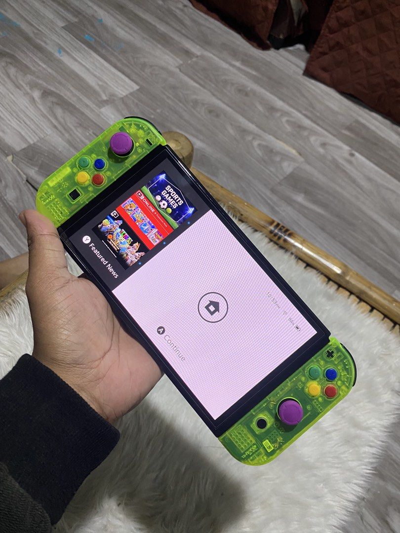 NINTENDO SWITCH OLED (RESHELL) (Category: Nintendo) located in Manila. Submitted by elaaa07 (Listing ID 1450102874, Image 2). Description: NINTENDO SWITCH OLED (RESHELL) - READY TO USE W/ DOCK CHARGER JOYCON GRIP JOYCON STRAP ORIGINAL BACK PLATE - NO GAMES.