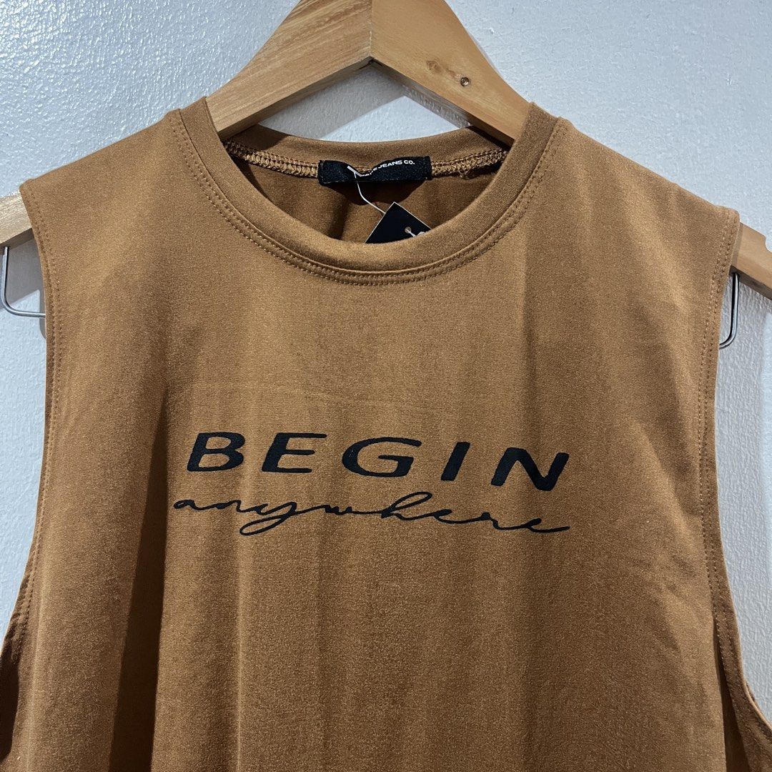 PAGE JEANS CO. Sleeveless Tee (Category: Tshirts & Polo Shirts ) located in Manila. Submitted by declutterfairy_ph (Listing ID 1450011624, Image 2). Description: -Size: no size tag but can fit S-M -Unused, still with tag. -No flaw/s. -Printed Design: “ Begin anywhere”..