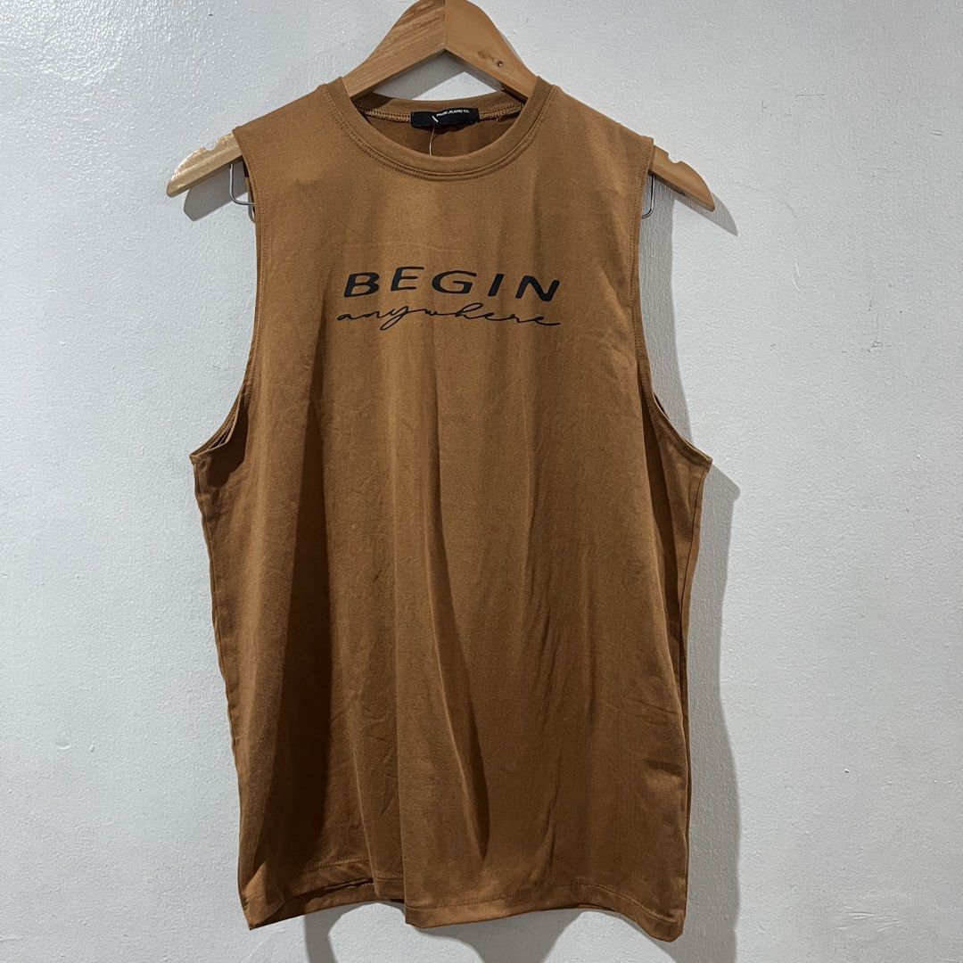 PAGE JEANS CO. Sleeveless Tee (Category: Tshirts & Polo Shirts ) located in Manila. Submitted by declutterfairy_ph (Listing ID 1450011624, Image 1). Description: -Size: no size tag but can fit S-M -Unused, still with tag. -No flaw/s. -Printed Design: “ Begin anywhere”..