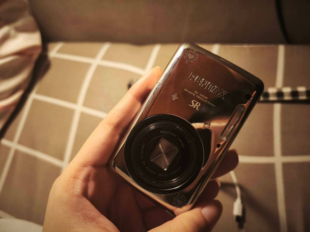 Pentax Optio S1 - Digicam (Category: Cameras) located in Manila. Submitted by e_clairrr (Listing ID 1450134075, Image 2). Description: For sale: Second-hand/Pre-owned Pentax Optio S1 Complete Set Price: 4,500 (negotiable) Location: Quezon City Details: - No issues, fully working - 5x zoom - Shake reduction feature for videos - with 23 filters and camera modes Inclusions: - hard case/cute cotton pouch - 2 batteries - 128GB SD card - USB-C OTG - Un