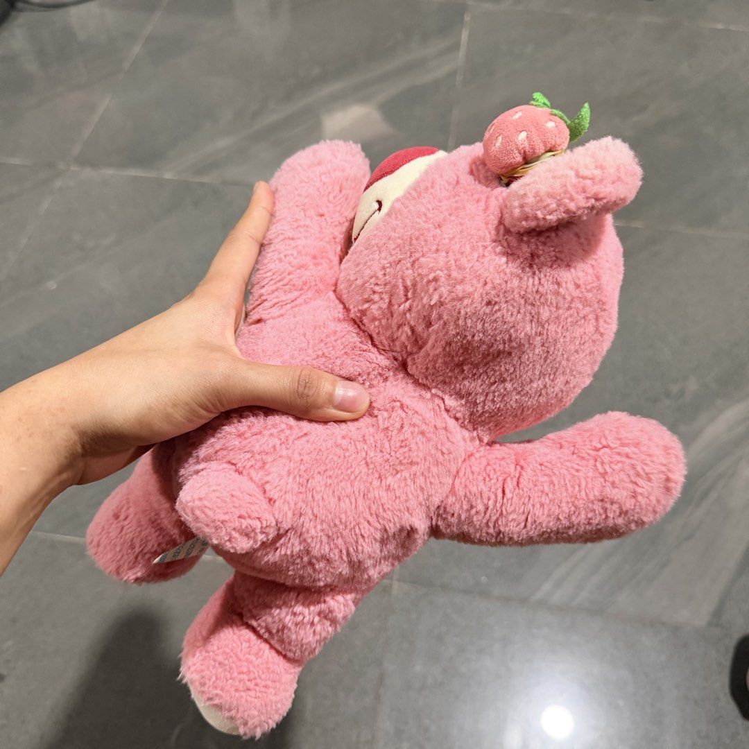 Pink Strawberry Bear Plush Toy (Category: Plushies & Soft Toys) located in Quezon City. Submitted by ThirftyClub (Listing ID 1449953468, Image 3). Description: - Adorable pink bear plushie - Features a cute strawberry on its head - Made with soft and cuddly material - Perfect for collectors or as a thoughtful gift.