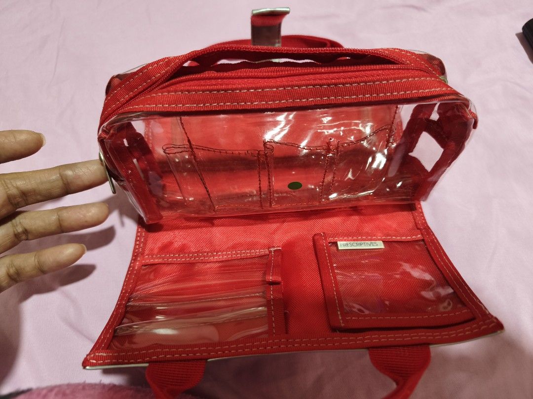 Prescriptives Red Cosmetic Bag Organizer with Clear Pockets (Category: Makeup) located in La Paz. Submitted by carou89146 (Listing ID 1450106518, Image 3). Description: - Prescriptives red cosmetic bag - Multiple clear interior pockets for organization - Clear main compartment - Folds open and closed with a snap strap - Ideal for travel or everyday use - Compact and functional design GCash plus sf location Ilocos Province jnt Express .
