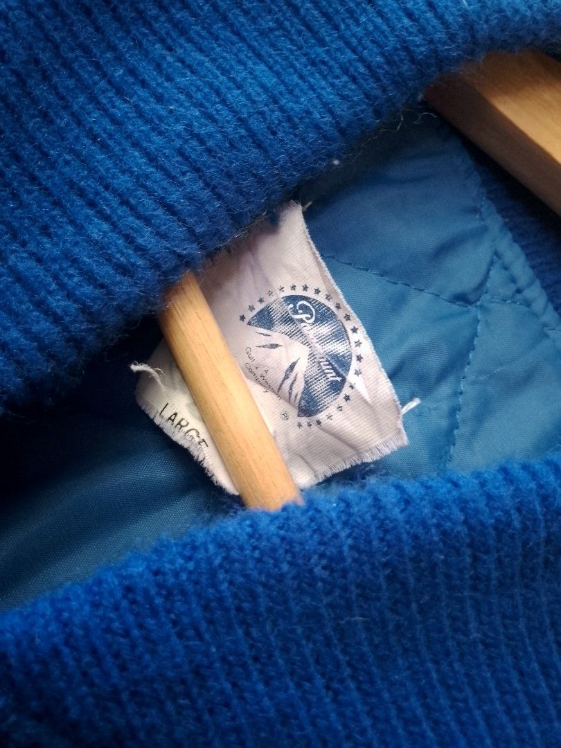 RARE Vintage Paramount film crew Jacket (Category: Coats, Jackets and Outerwear) located in Manila. Submitted by ianpreloveditems (Listing ID 1450058720, Image 3). Description: - Blue and white film crew jacket from Paramount - Size: Large (tag) - Features Paramount logo and 'Gulf + Western Company' on the back - White sleeves with blue body and collar - Quilted lining for warmth - Inner tag has the name 'Ted Bauman' written on it.