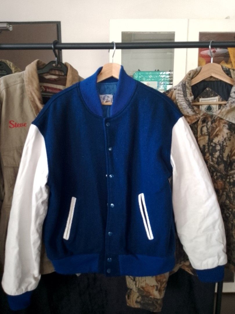 RARE Vintage Paramount film crew Jacket (Category: Coats, Jackets and Outerwear) located in Manila. Submitted by ianpreloveditems (Listing ID 1450058720, Image 2). Description: - Blue and white film crew jacket from Paramount - Size: Large (tag) - Features Paramount logo and 'Gulf + Western Company' on the back - White sleeves with blue body and collar - Quilted lining for warmth - Inner tag has the name 'Ted Bauman' written on it.