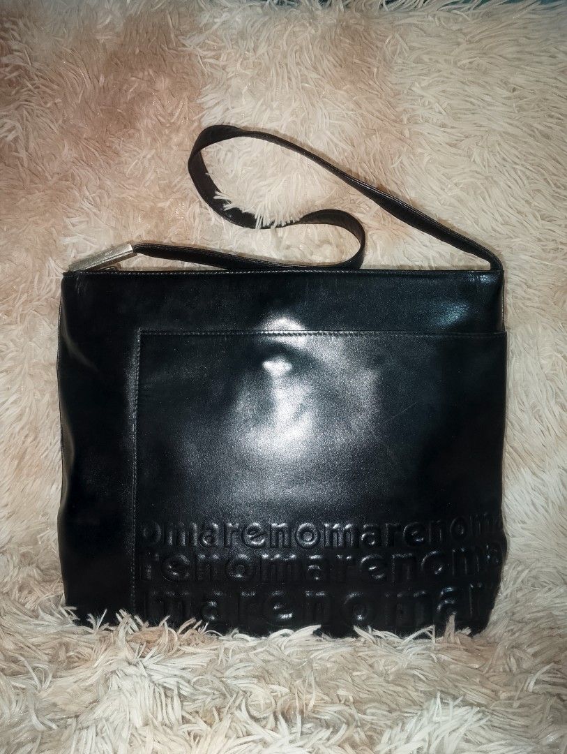 RENOMA Black Leather Shoulder Bag with Embossed Logo (Category: Shoulder Bags) located in Manila. Submitted by triple_r.shop.ph (Listing ID 1450048968, Image 1). Description: - Genuine black leather shoulder bag - Elegant embossed logo pattern on the front - Secure zipper closure located on the back - Chic silver hardware detail on the strap - Protective studs on the bottom for durability - Ideal size for everyday use and carrying essentials.