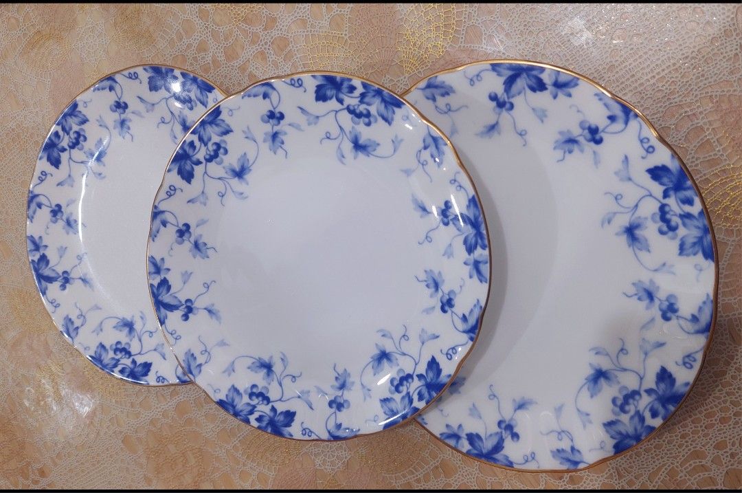 Sango Fine China Blue Floral Plates Set (Category: Dinnerware & Cutlery) located in Quezon City. Submitted by letsdecluttermanila (Listing ID 1450114306, Image 1). Description: - Set of Sango fine china plates - Features a delicate blue floral vine pattern - Elegant gold trim around the edges - Made in Japan - Ideal for serving guests or as a decorative display piece.